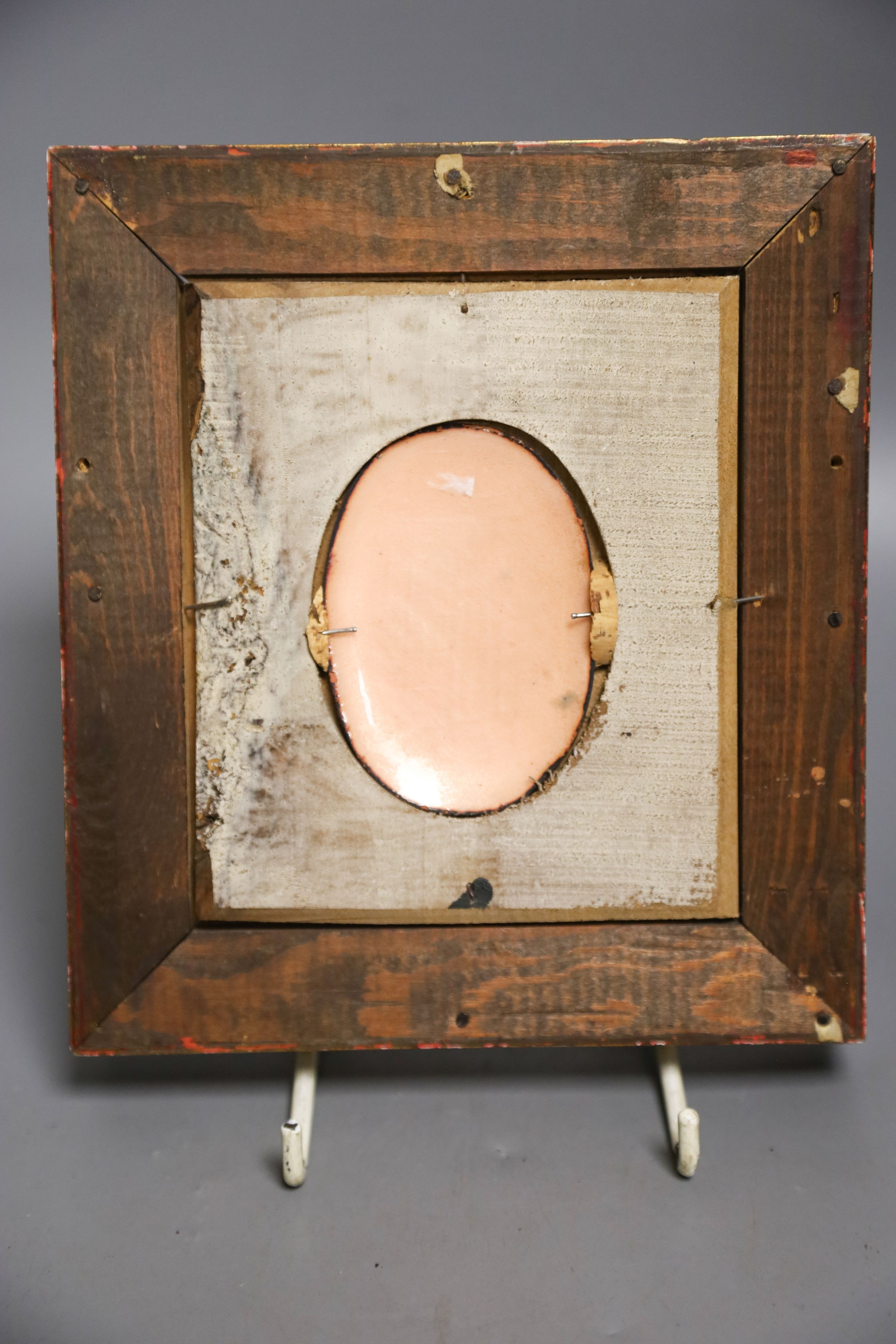 A small oval Limoges miniature enamelled portrait plaque, signed L. Fauré, framed 8x5.5cm excl frame